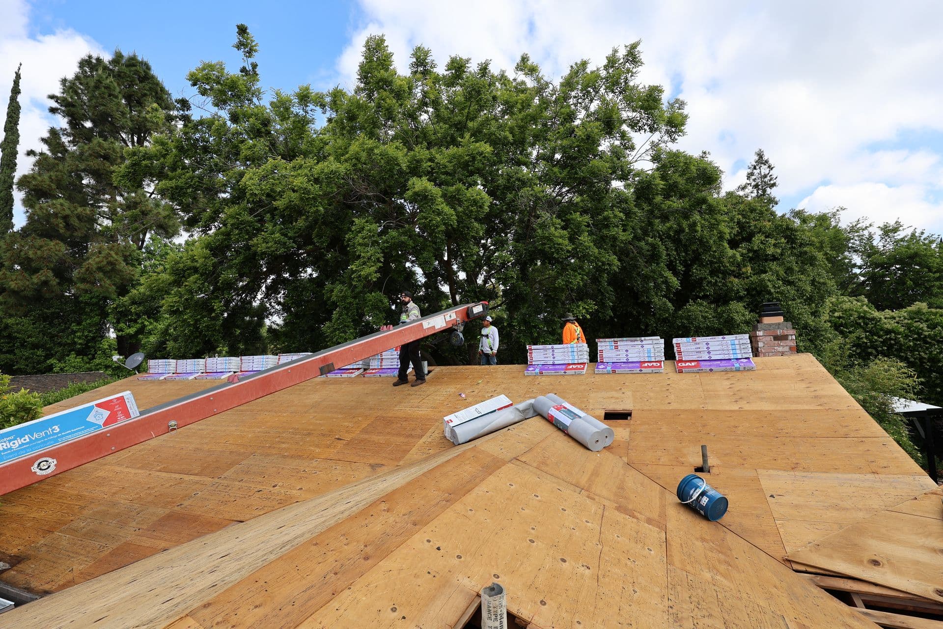Men on roof installing panels