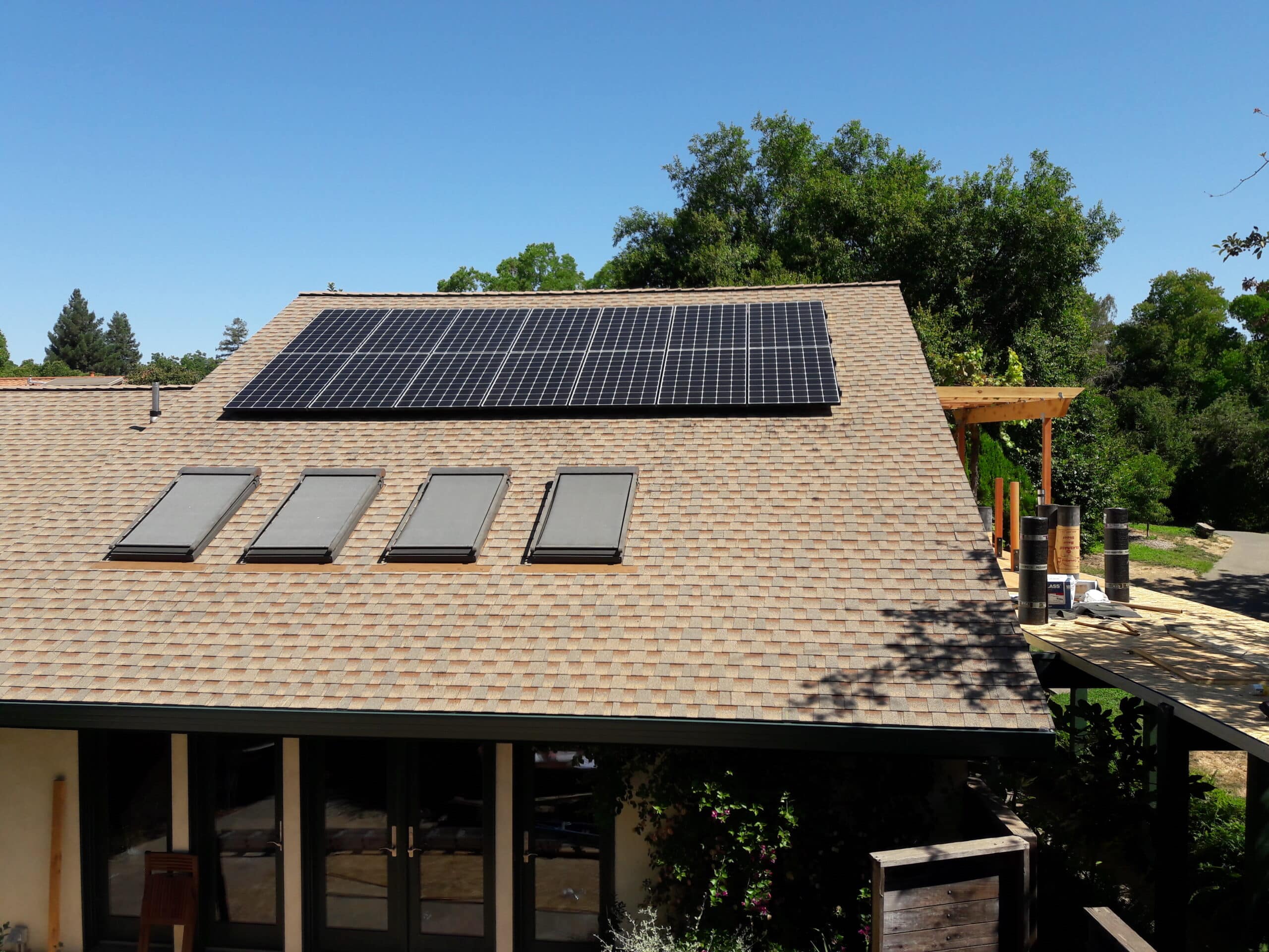 Roof with solar panels and skylights.