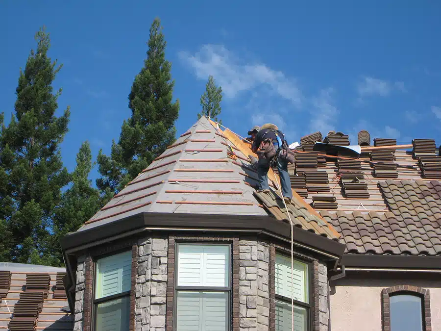 Yancey roofers installing shingles on residential home in Sacramento, CA.