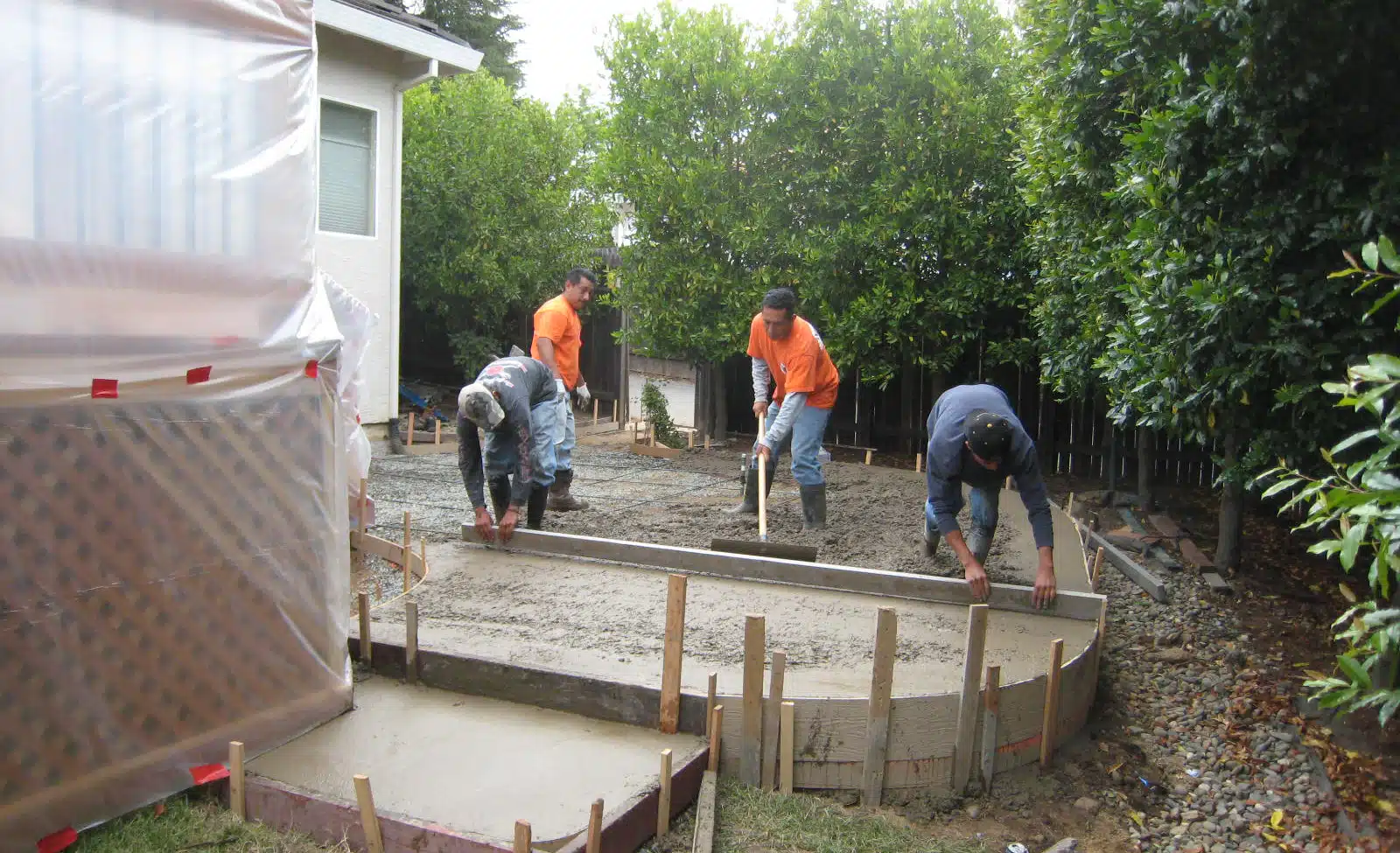 Yancey employees laying concrete in residential home in Sacramento, CA.